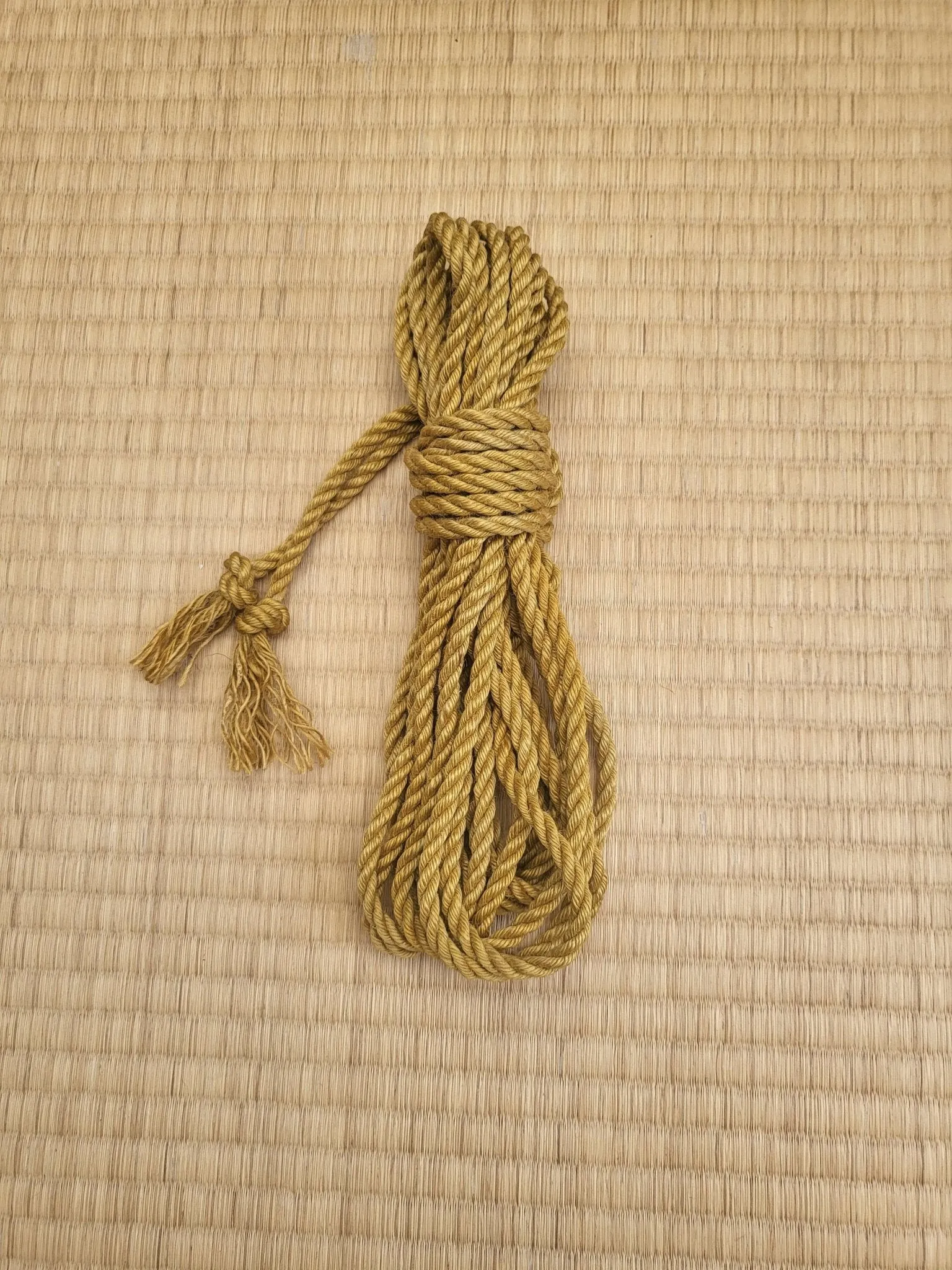 Mustard yellow jute shibari bondage rope.