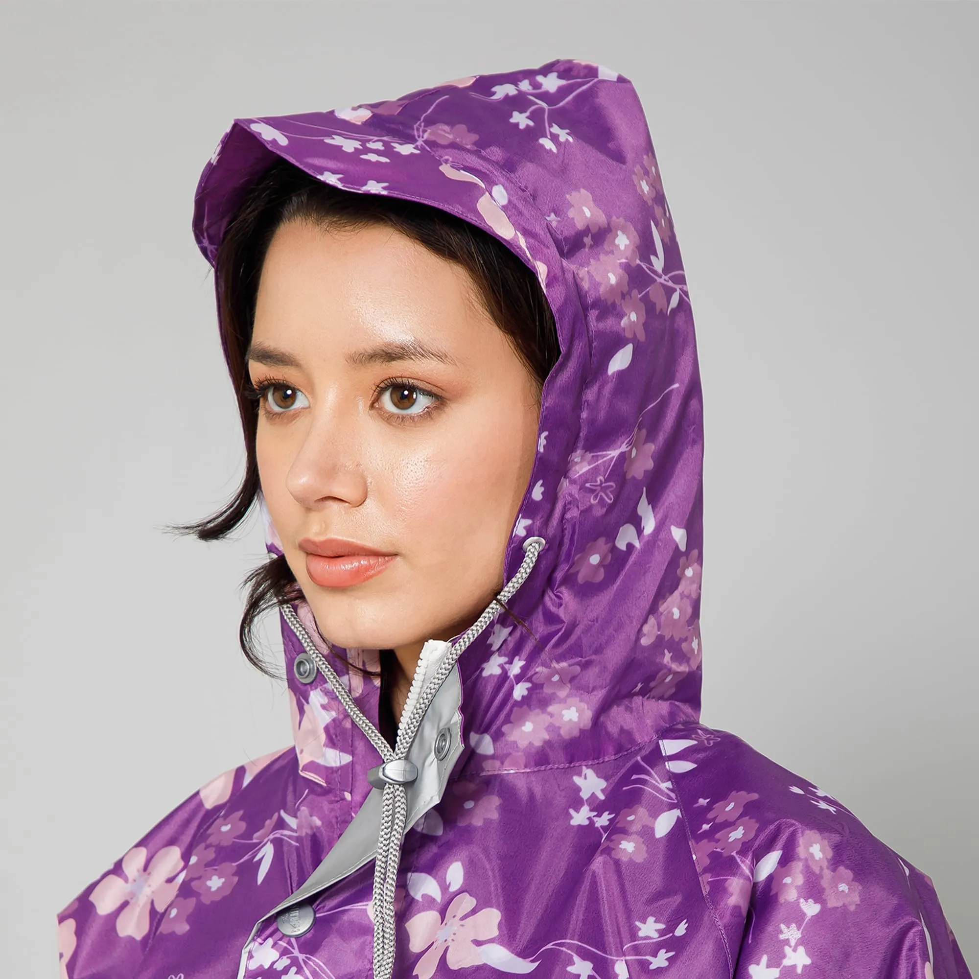 THE CLOWNFISH Polyester Waterproof Rain Coat For Women Skirt and Top Raincoat With Adjustable Hood and Front Pockets Rain Glam Series (Purple Floral, X-Large)