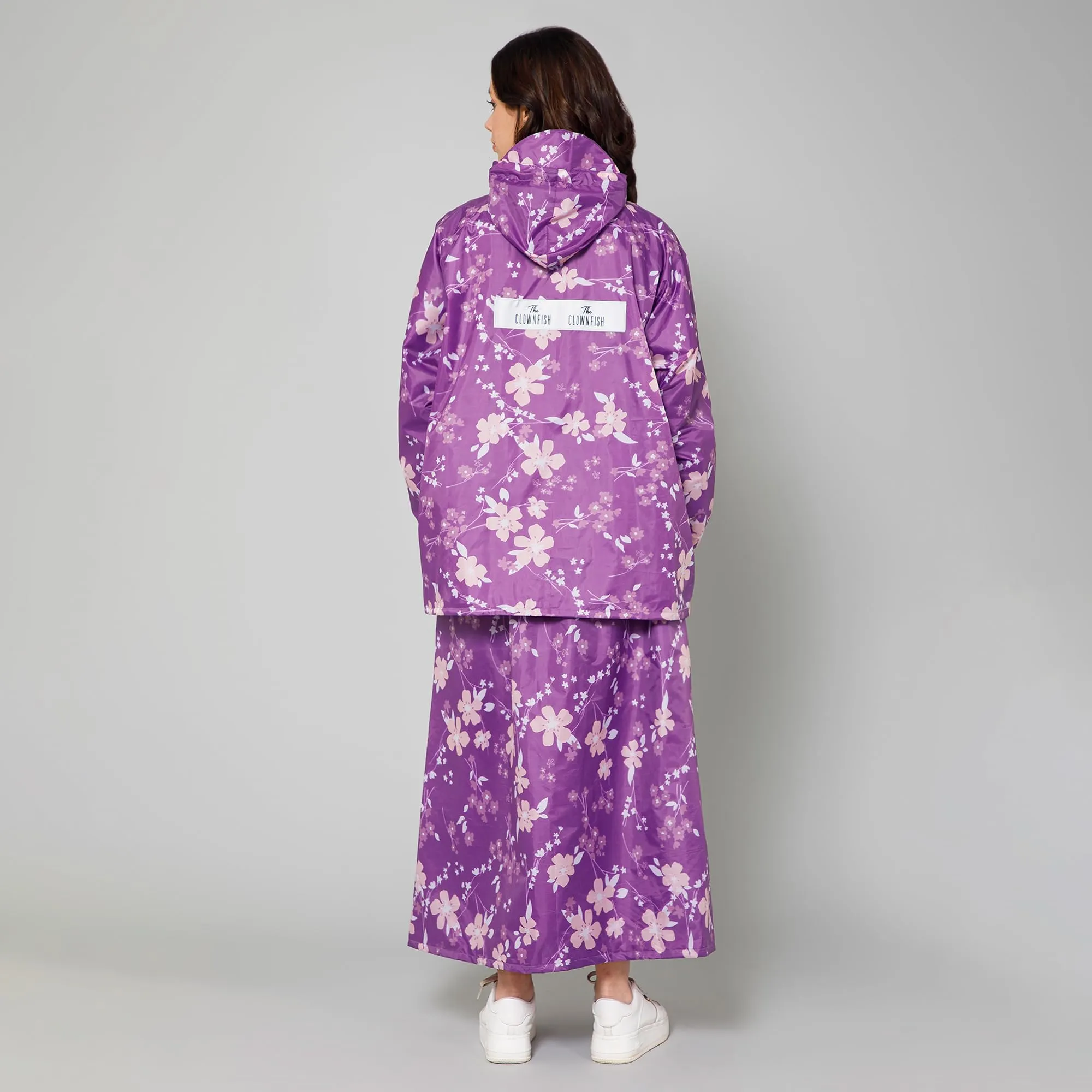 THE CLOWNFISH Polyester Waterproof Rain Coat For Women Skirt and Top Raincoat With Adjustable Hood and Front Pockets Rain Glam Series (Purple Floral, X-Large)